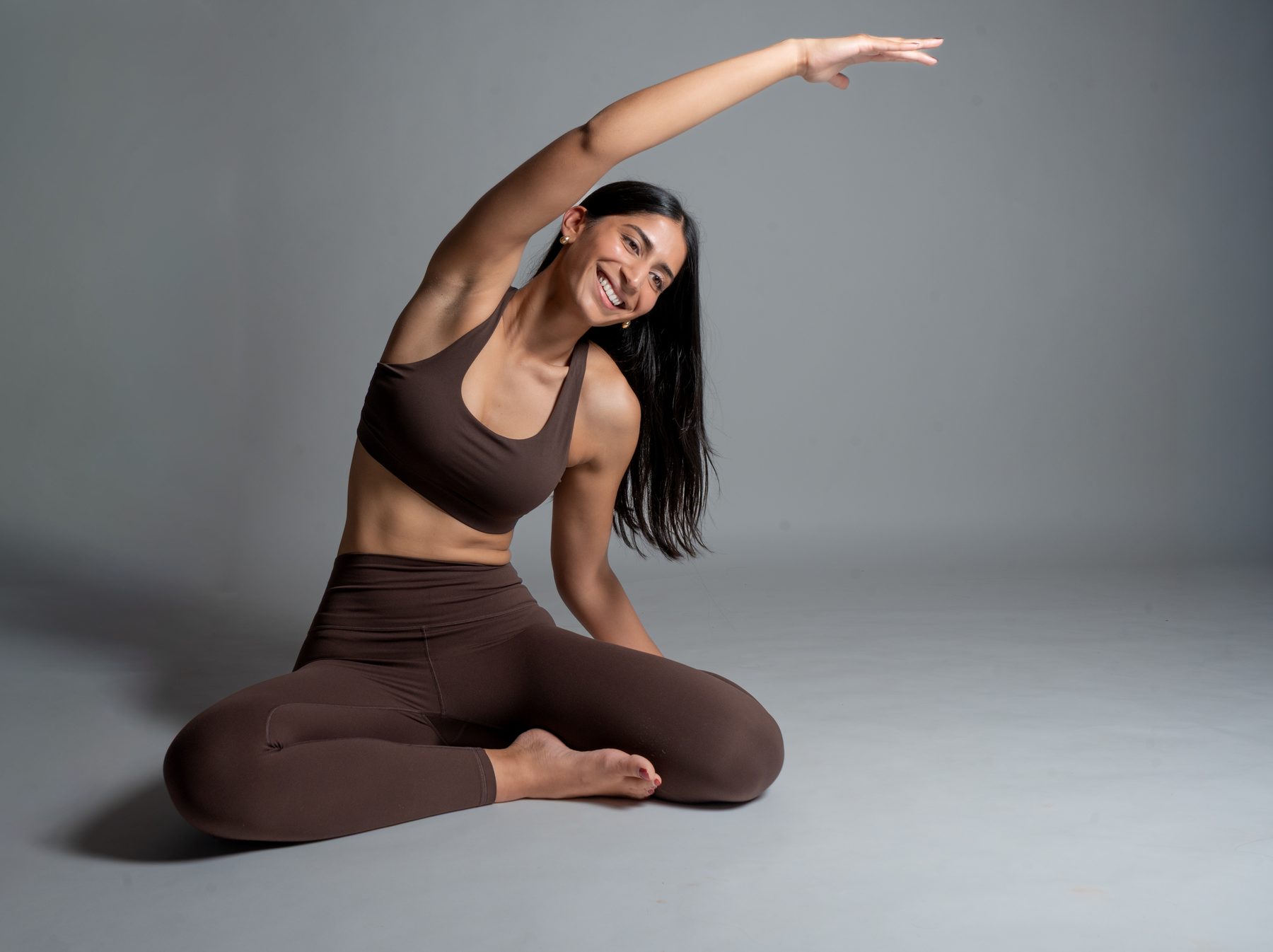 Smiling side stretch at Yoga 2.0