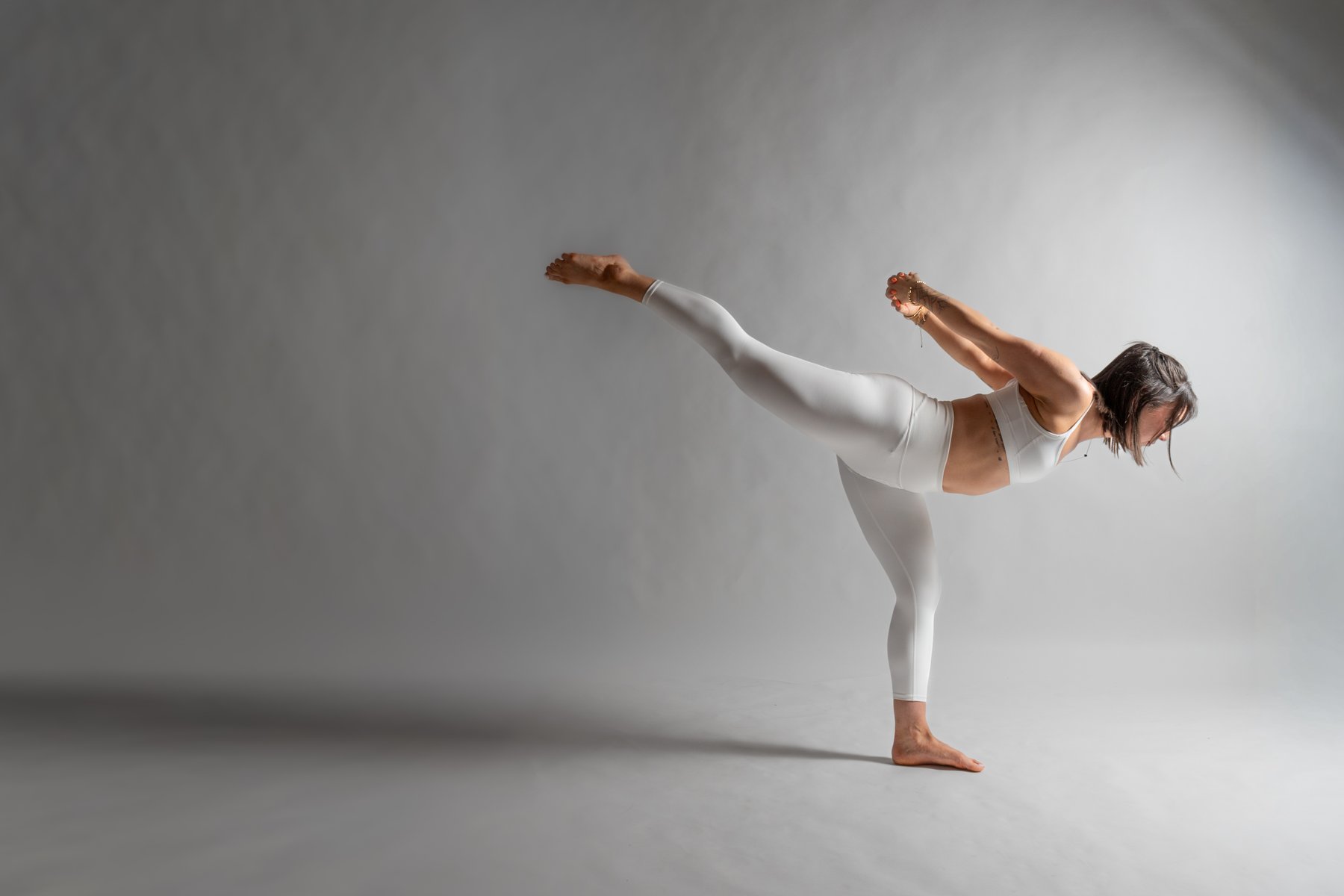 Standing balance pose in a heated yoga class at Yoga 2.0 in River North, Chicago